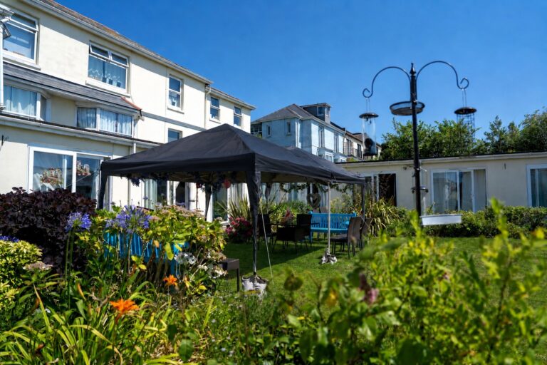 Mount Olivet's garden with a gazebo, blue benches and outdoor seating