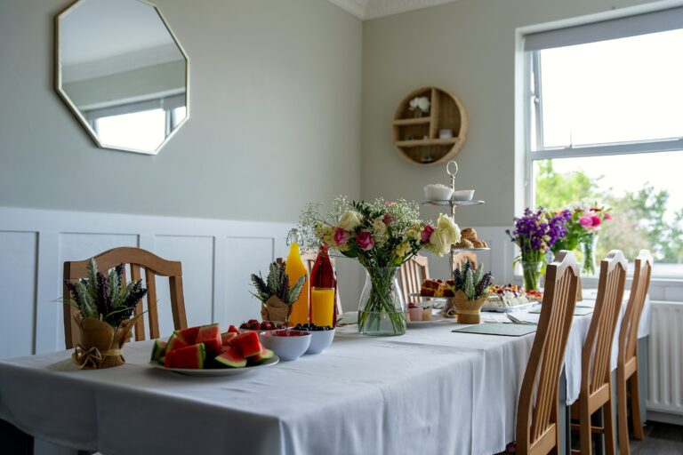 The dining room at Mount Olivet, set with afternoon tea and fresh flowers