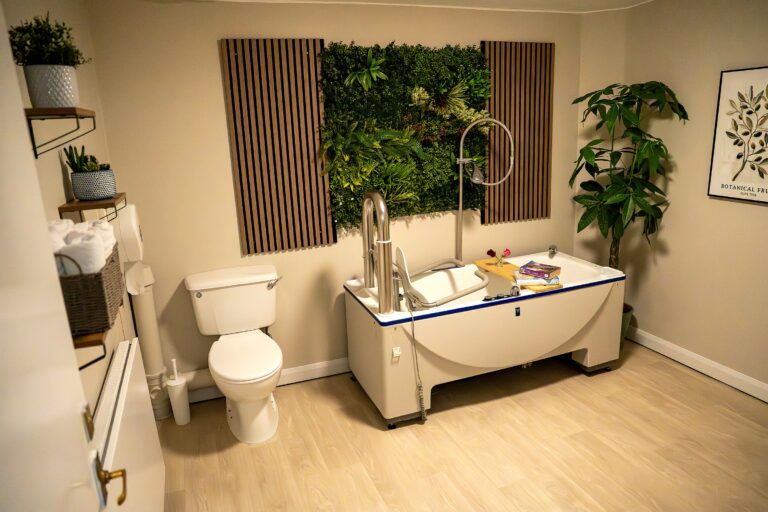 An assisted bathroom at Mount Olivet with a specialist bath and toiletries