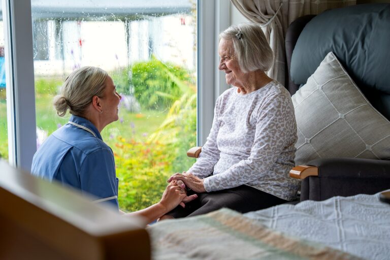 A caring moment between staff and a resident at Mount Olivet