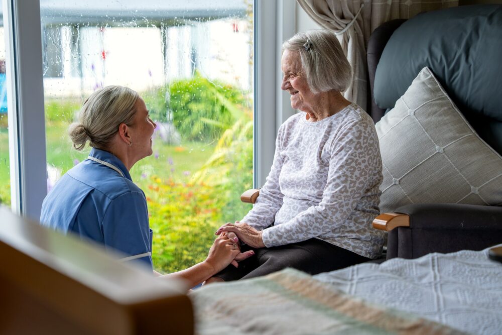 A caring moment between staff and a resident at Mount Olivet