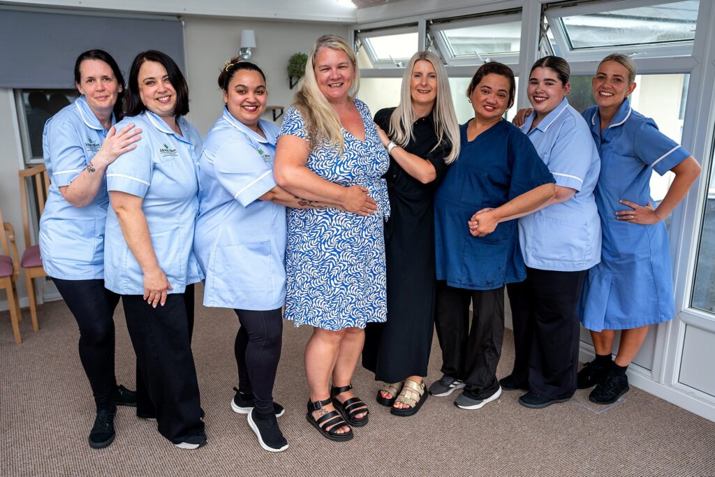 The Mount Olivet care team together in the conservatory